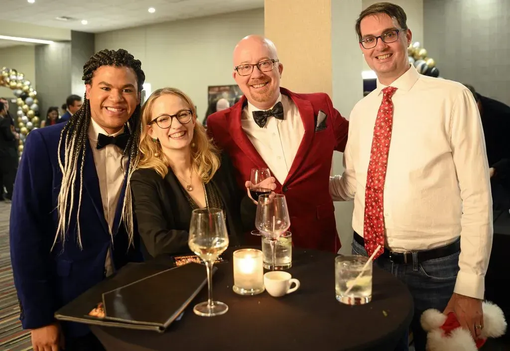 Shawn Wilsie and Shop LC employees at the yearly holiday party.