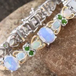 White opal and chrome diopside bracelet in sterling silver and gold.