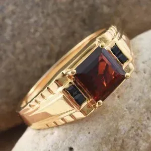Red garnet men's ring with gold finish. 