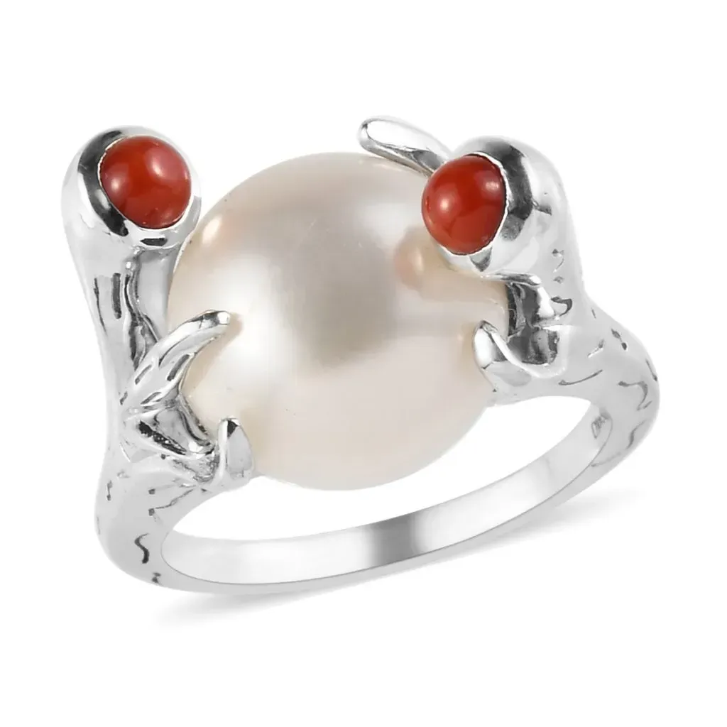 Pearl ring in custom setting with coral accents.