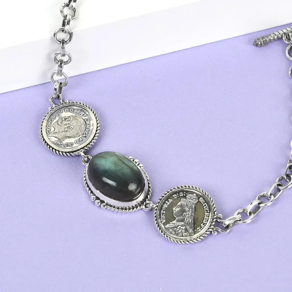 Sterling silver coin bracelet.