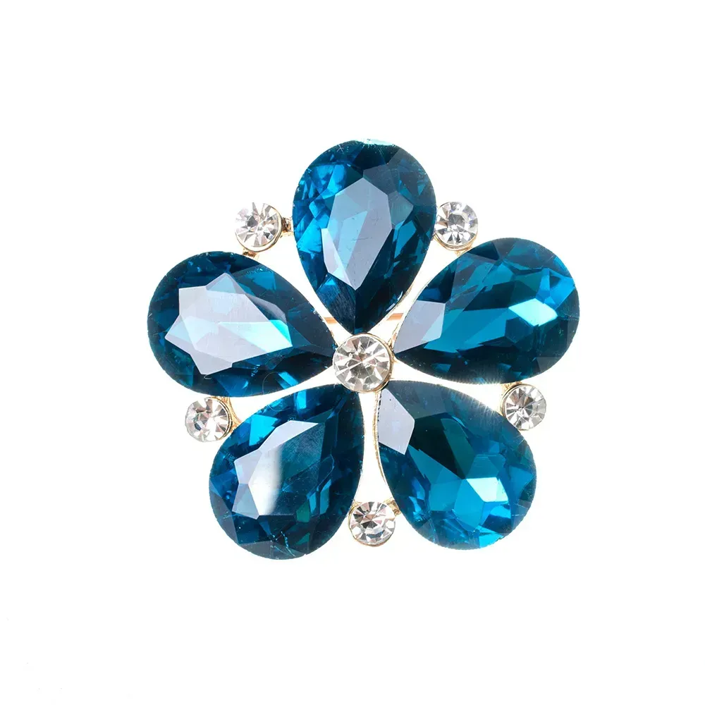 Closeup of blue flower gemstone brooch