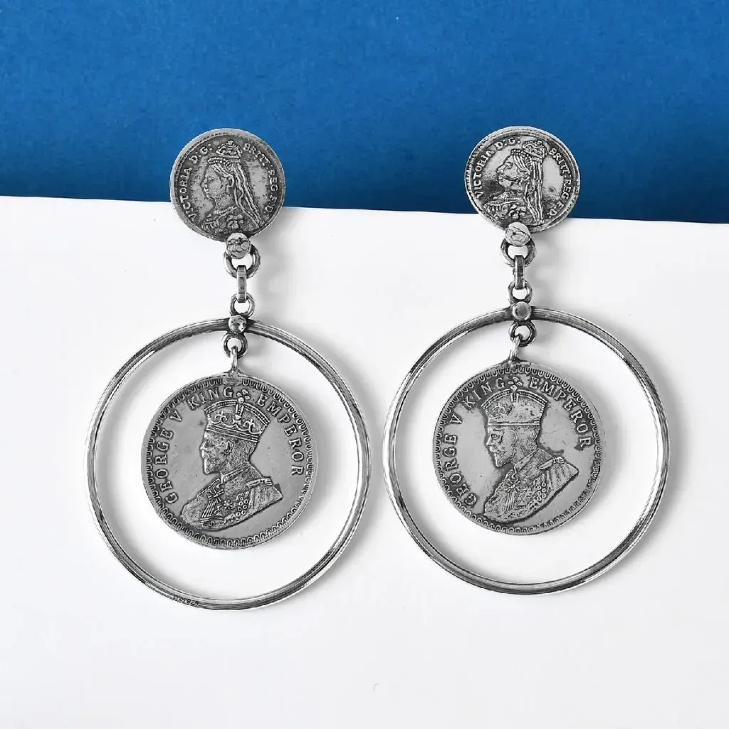 Sterling silver coin earrings.