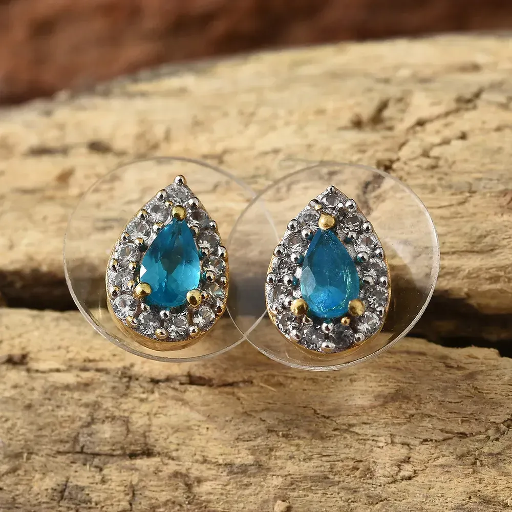 Apatite stud earrings against wood background