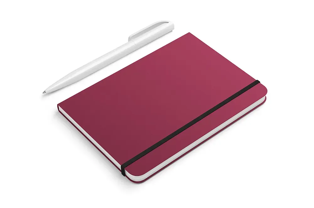 Closeup of plum notebook with white pen against white background