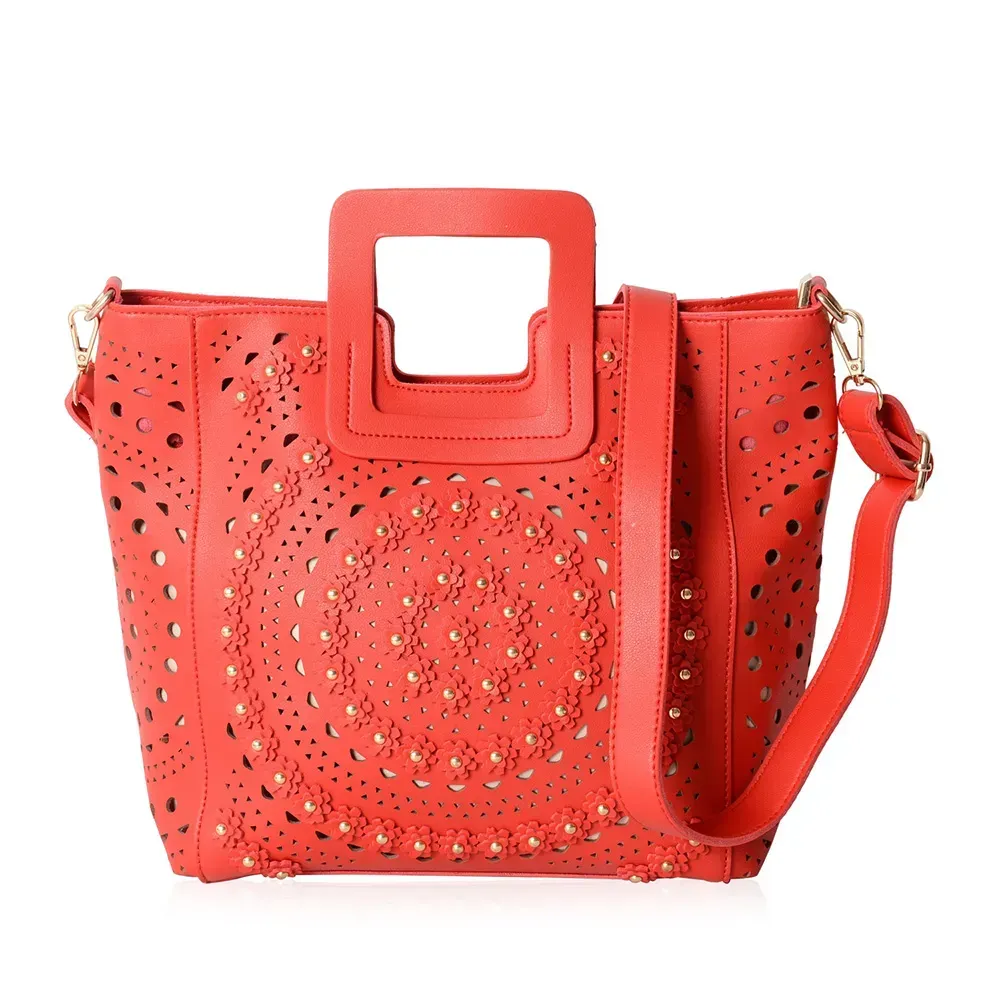 Closeup of red handbag against white background