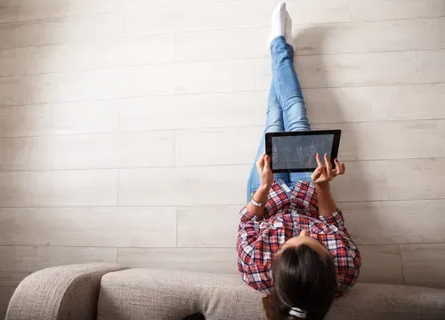 Woman shopping online through a tablet.