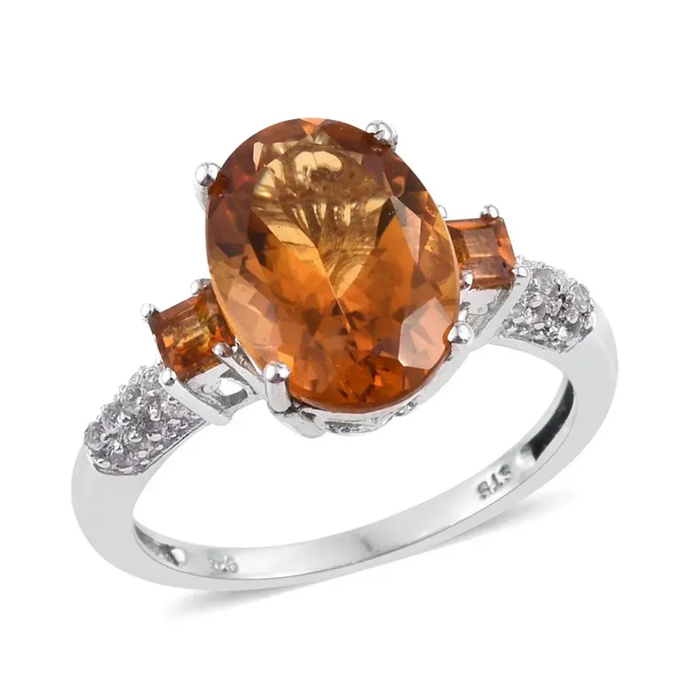 Closeup of citrine ring with silver band