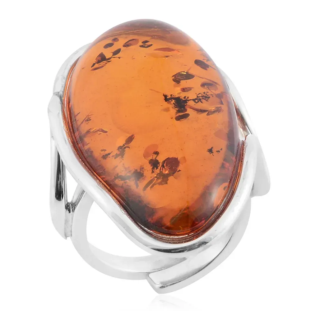 Closeup of orange baltic amber ring