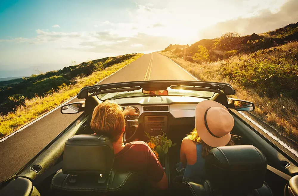 Couple having a jolly time on a road trip