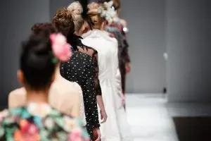 Models walking at a fashion show.