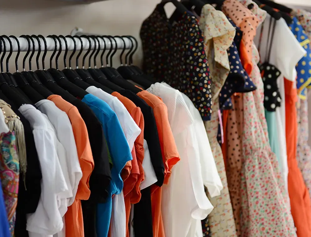 Clothes on hangers backstage at a Fashion Show