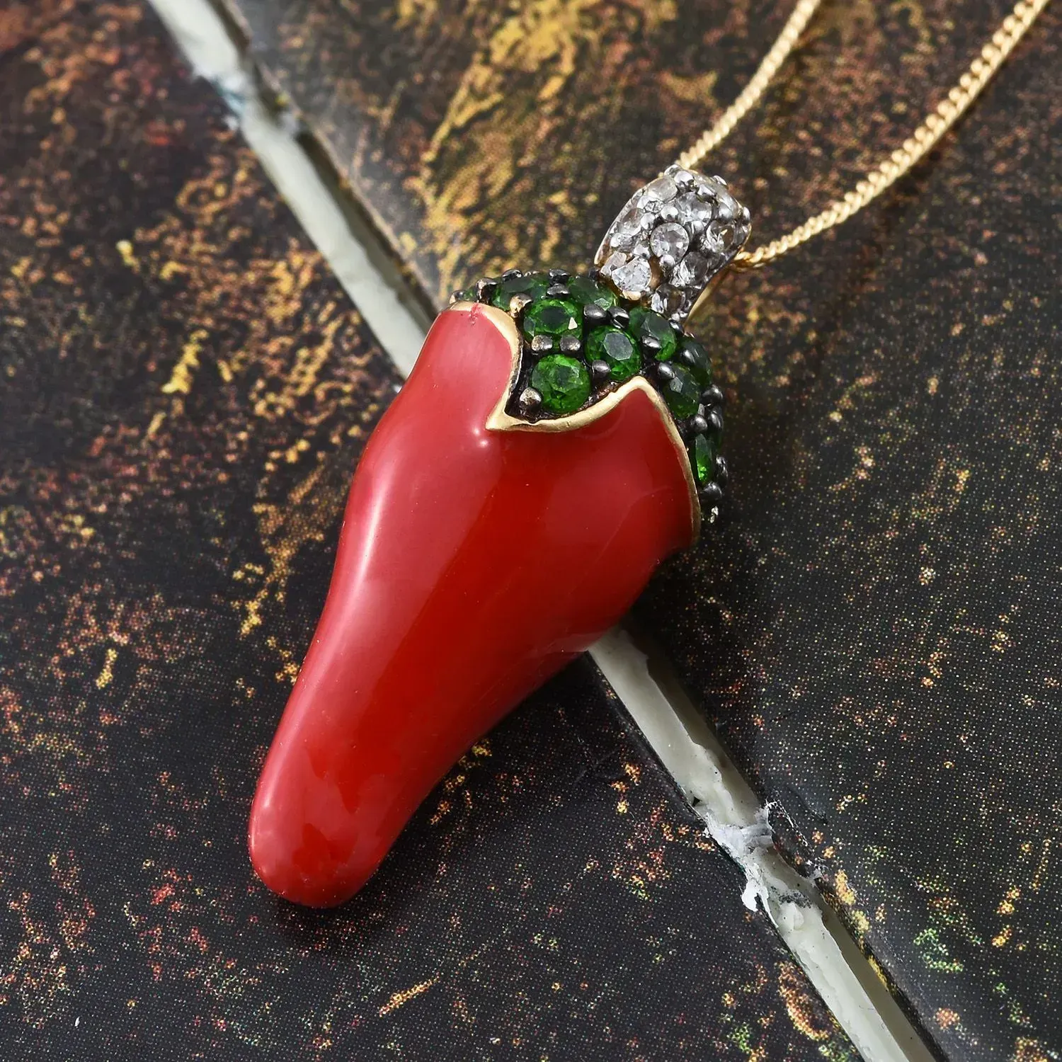 Enamel chili pepper pendant in sterling silver.