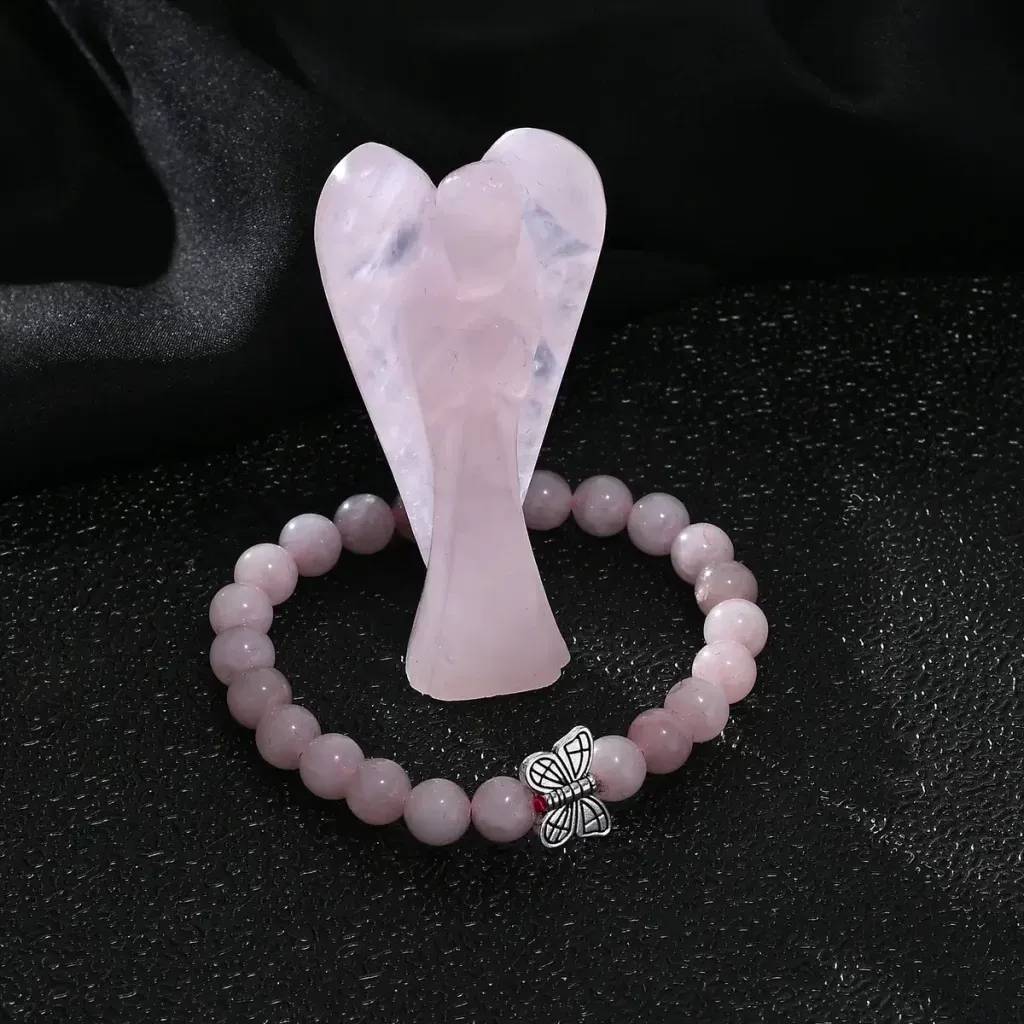 Hand-Carved-Rose-Quartz-Guardian-Angel-1024x1024.webp