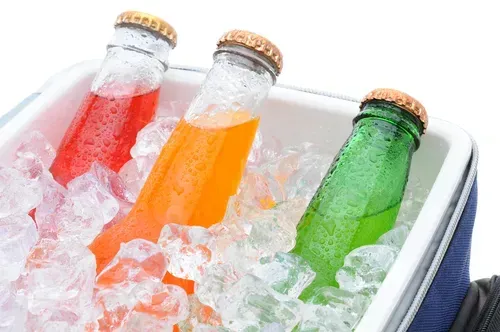 A ice chest with various cold drinks.