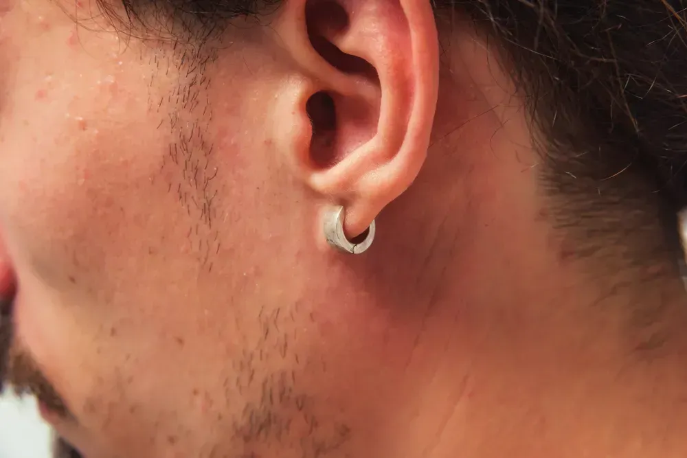 Closeup of man wearing earring