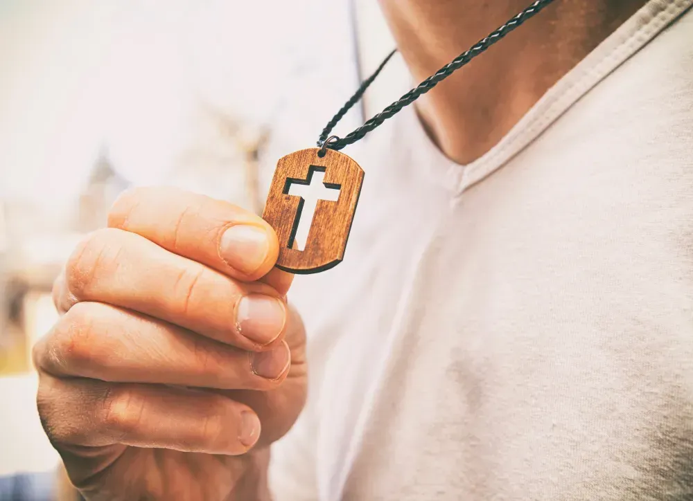 Man wearing a Cross jewelry