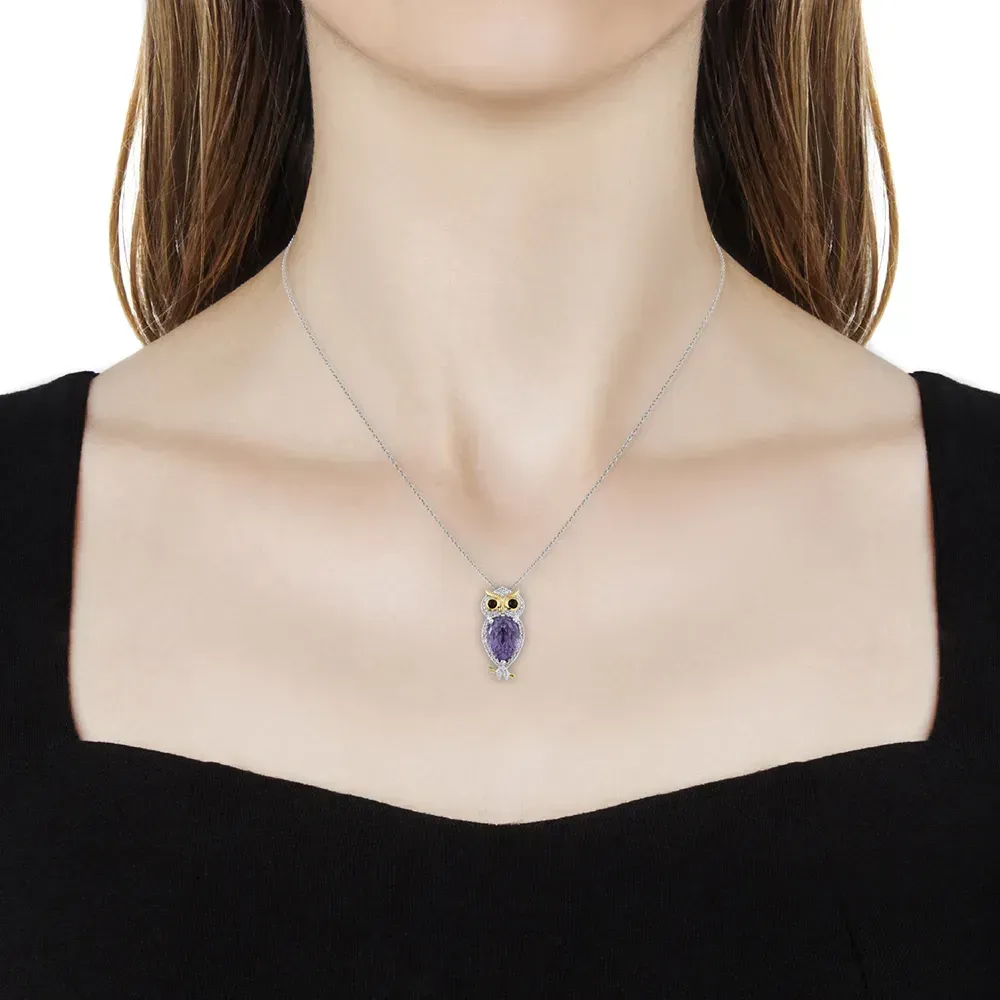 Closeup of owl pendant necklace