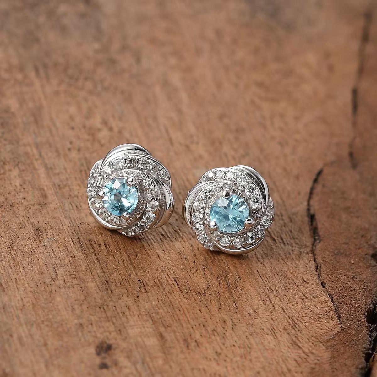 Premium Cambodian Blue Zircon and White Zircon Love Knot Earrings in Rhodium Over Sterling Silver.jpg