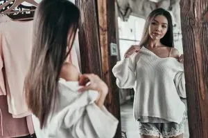 Woman trying on clothes.