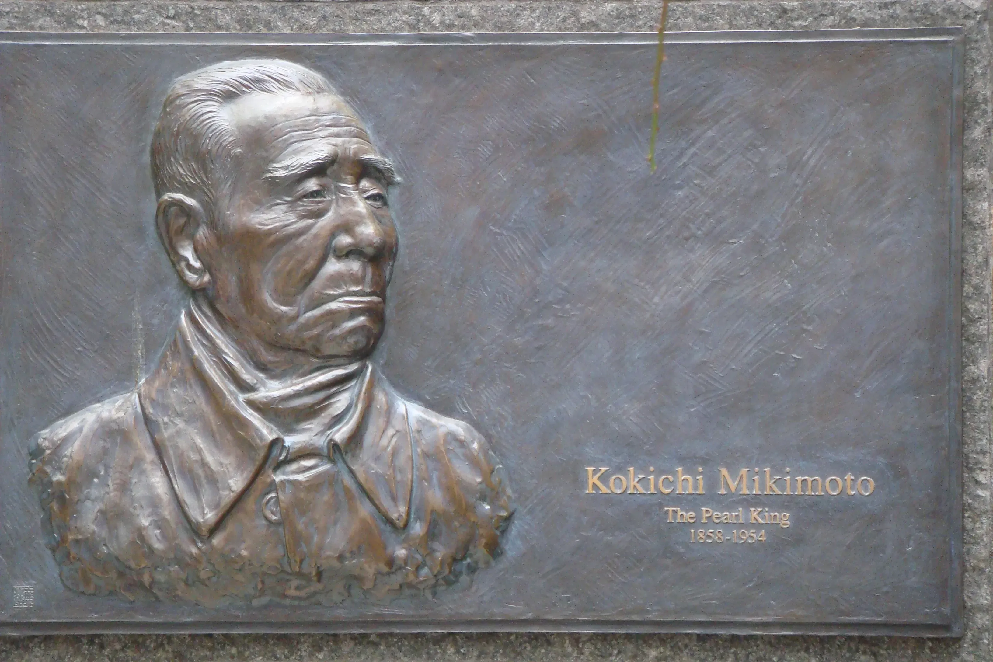 Bronze plaque honoring Mikimoto.