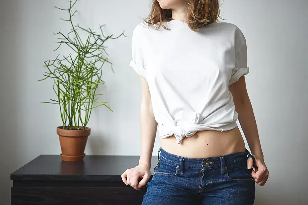 Woman wearing white loose tee.