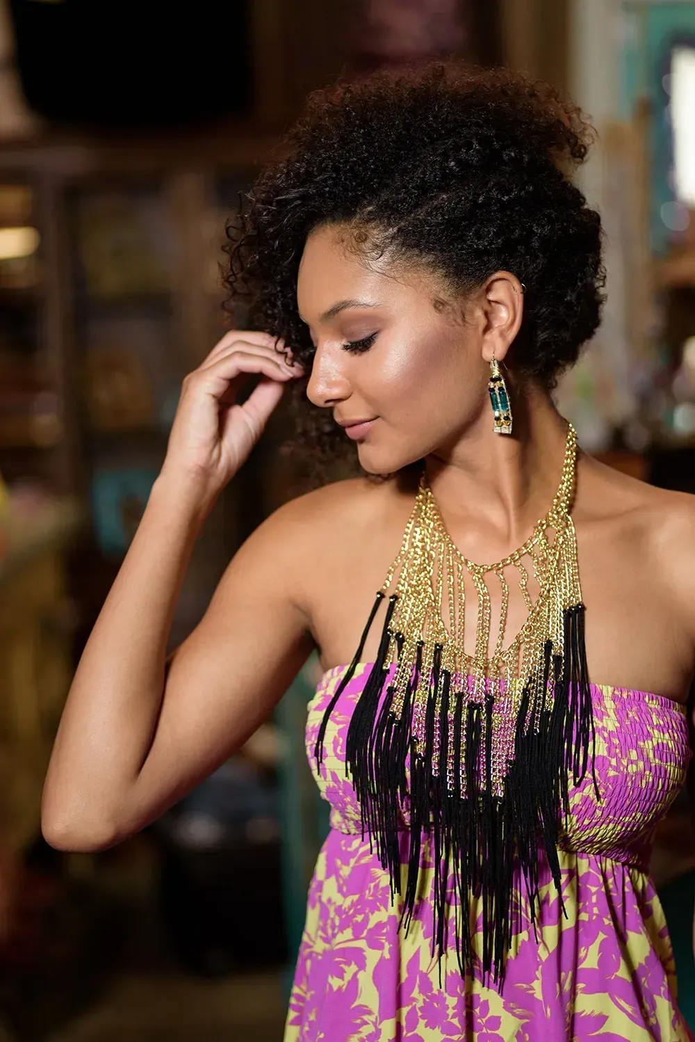 woman wearing strapless dress with dramatic necklace
