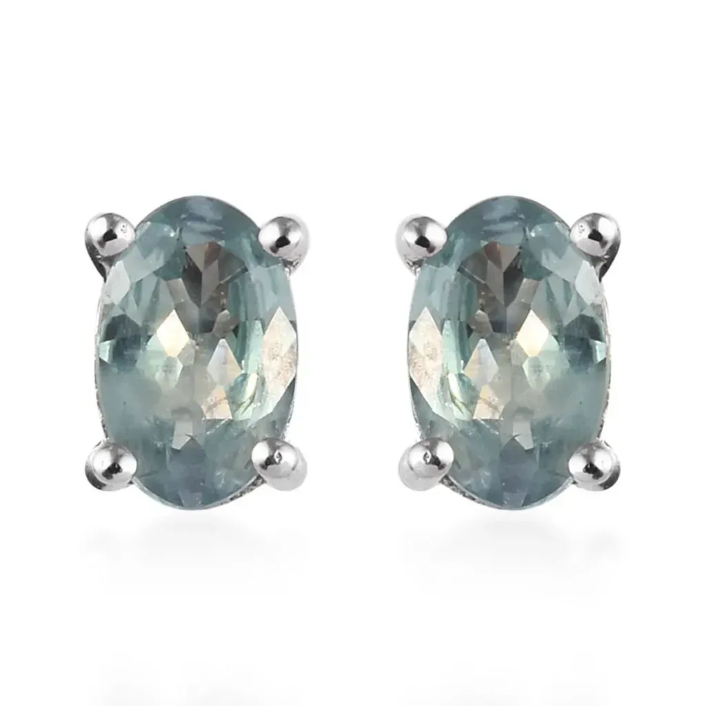 Alexandrite stud earrings showing bluish green color change. 