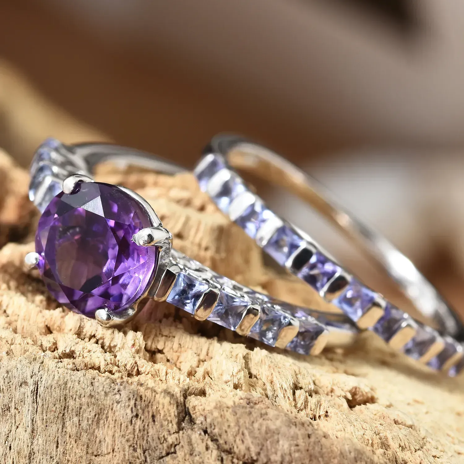 Moroccan amethyst ring set displayed on wooden stand.