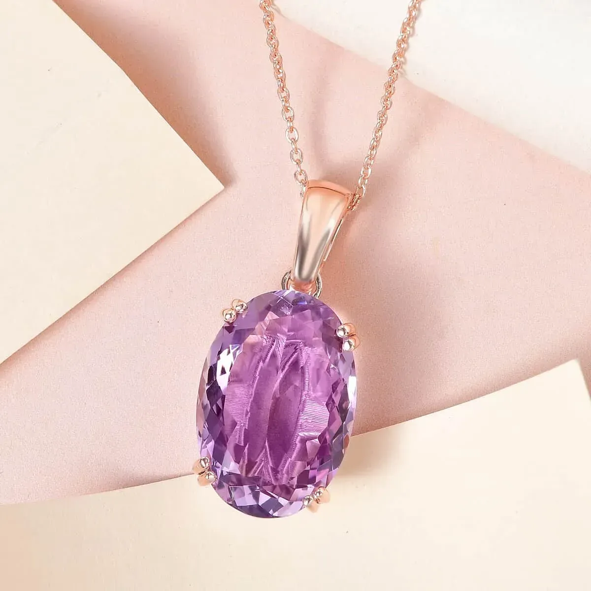 Rose De France Amethyst Solitaire Pendant Necklace,Solitaire Pendant, 20 Inches Necklace, Sterling Silver Necklace, Amethyst Solitaire Pendant against cream and pink background.