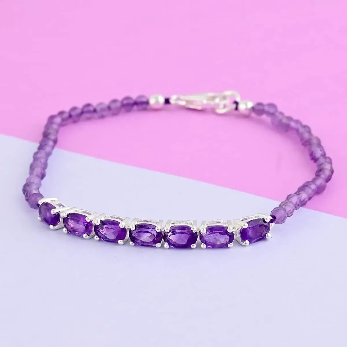 Amethyst Bracelet in Sterling Silver, Birthstone Jewelry, Gifts For Women against lavender and pink background.