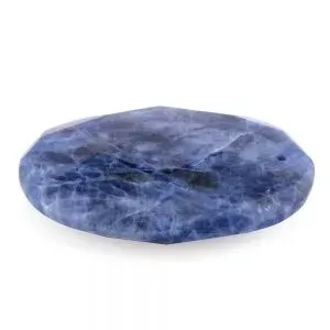 Tumbled blue sodalite stone on white background.