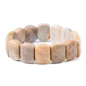 Beige coral stretch bracelet on white background.