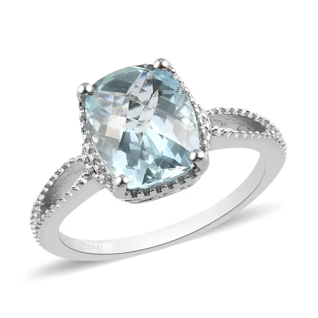Sterling silver ring with light blue gem. 