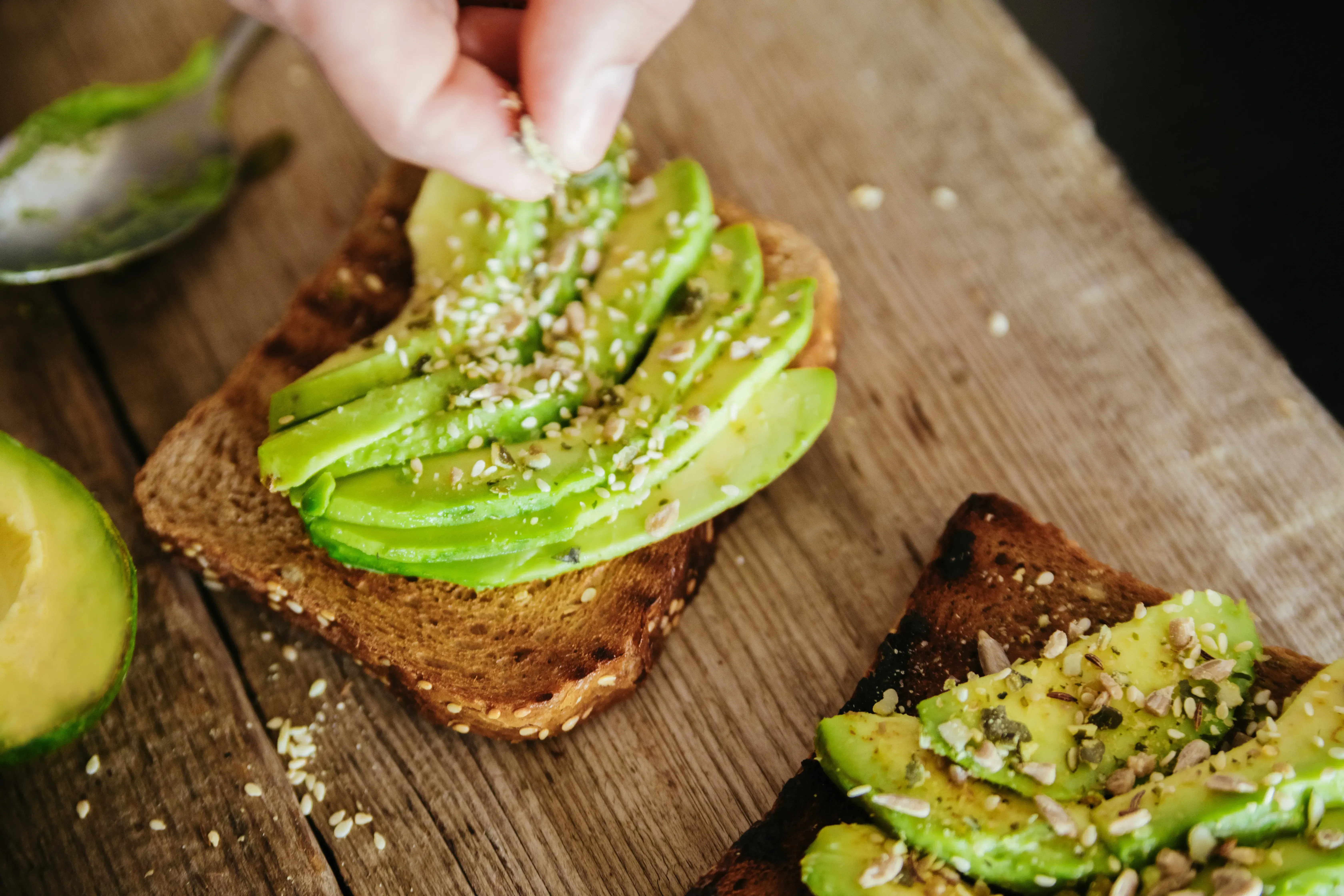 Avocado toast on wooden table. 