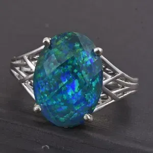 Synthetic opal doublet split shank ring in sterling silver.