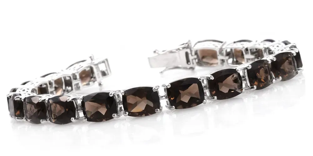 Smoky quartz bracelet against white background. 