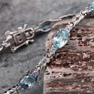Blue zircon and tanzanite line bracelet in sterling silver.