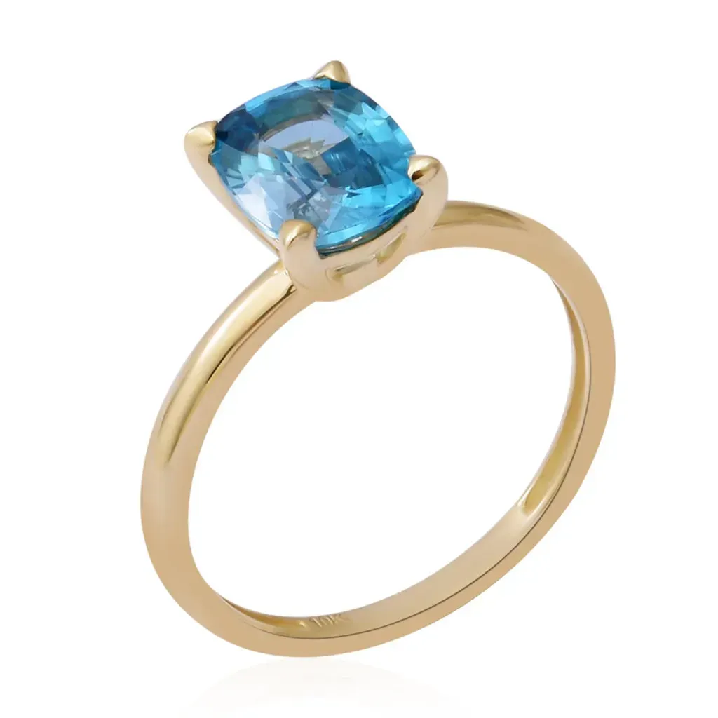 Blue zircon gold engagement ring. 