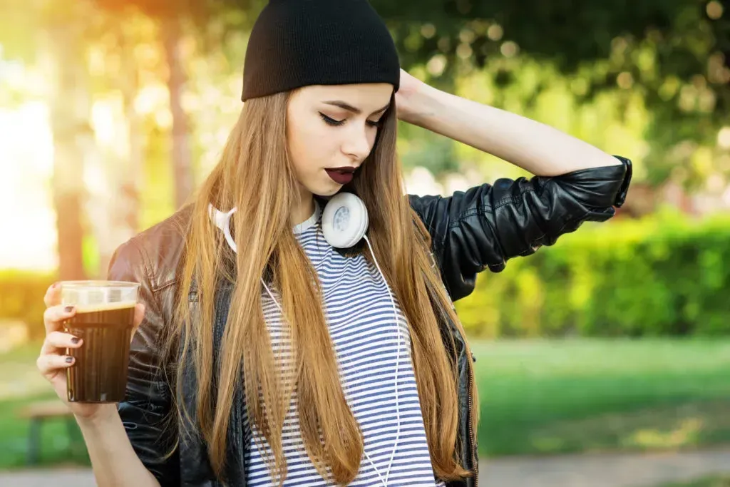 Cool young woman with bold lipstick.