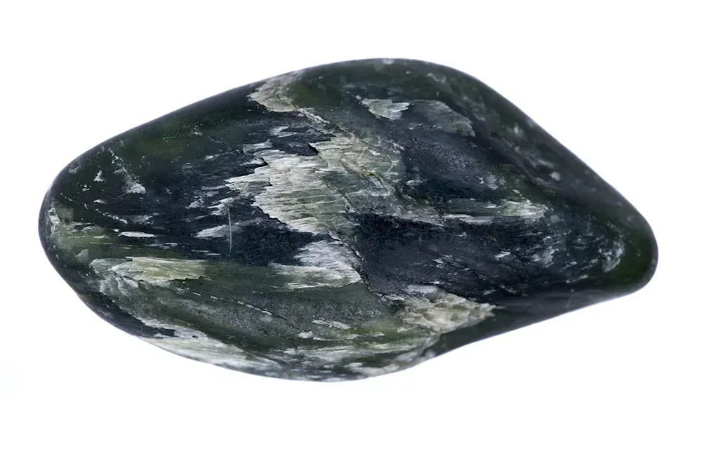 Tumbled bowenite gem.