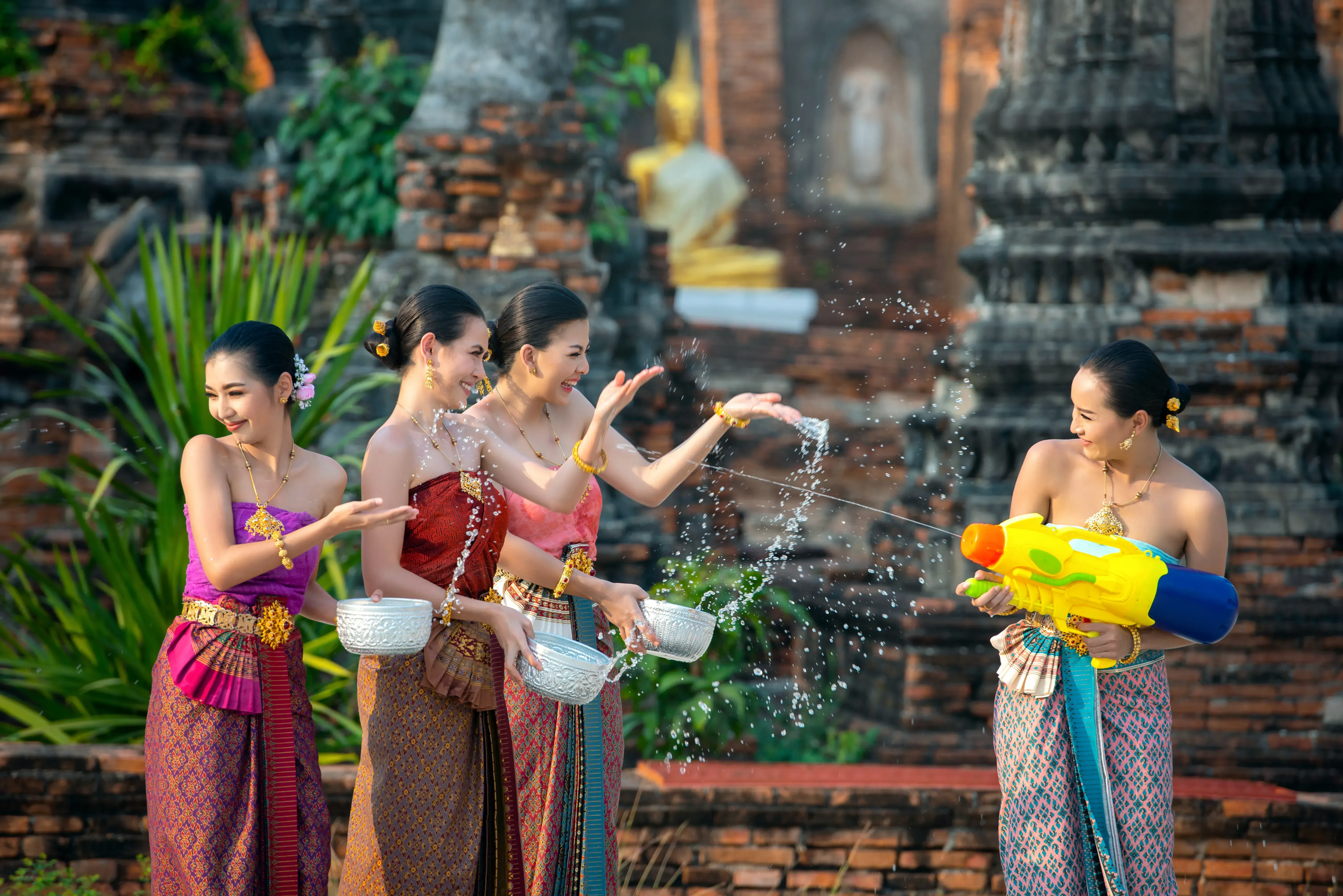 Cambodian women celebrating New Year with traditional water play.