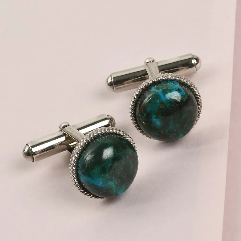Sterling silver cufflinks with blue green gemstone accents. 