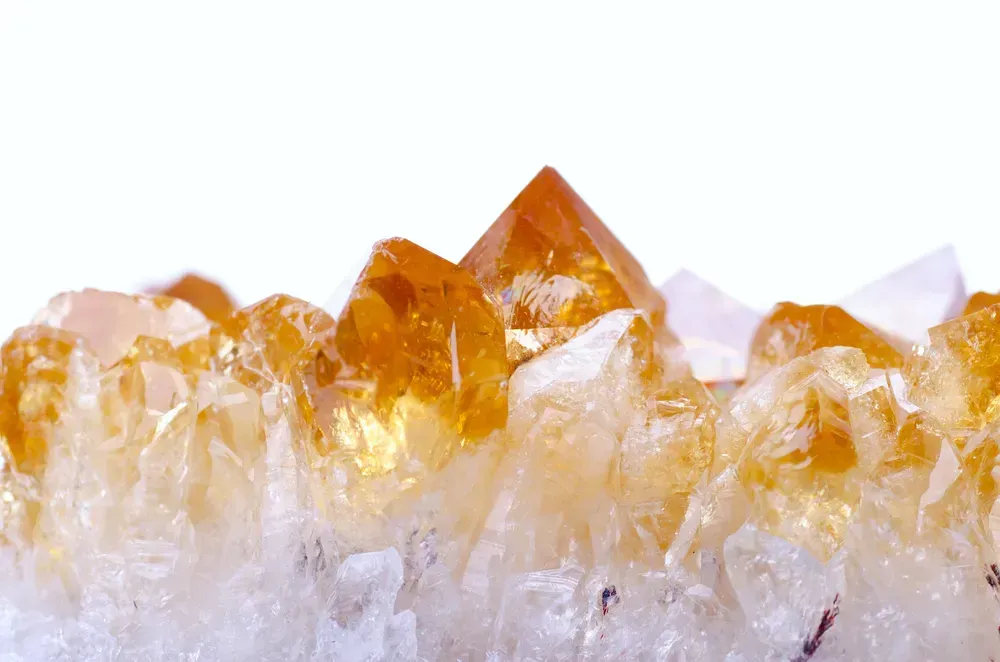 Citrine crystal on white background.