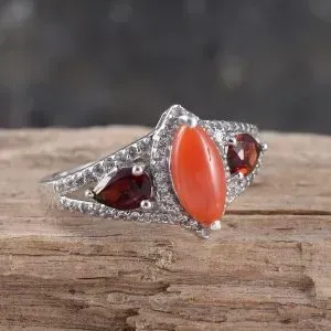 Meriterranean coral ring with pyrope accents in sterling silver with platinum finish.