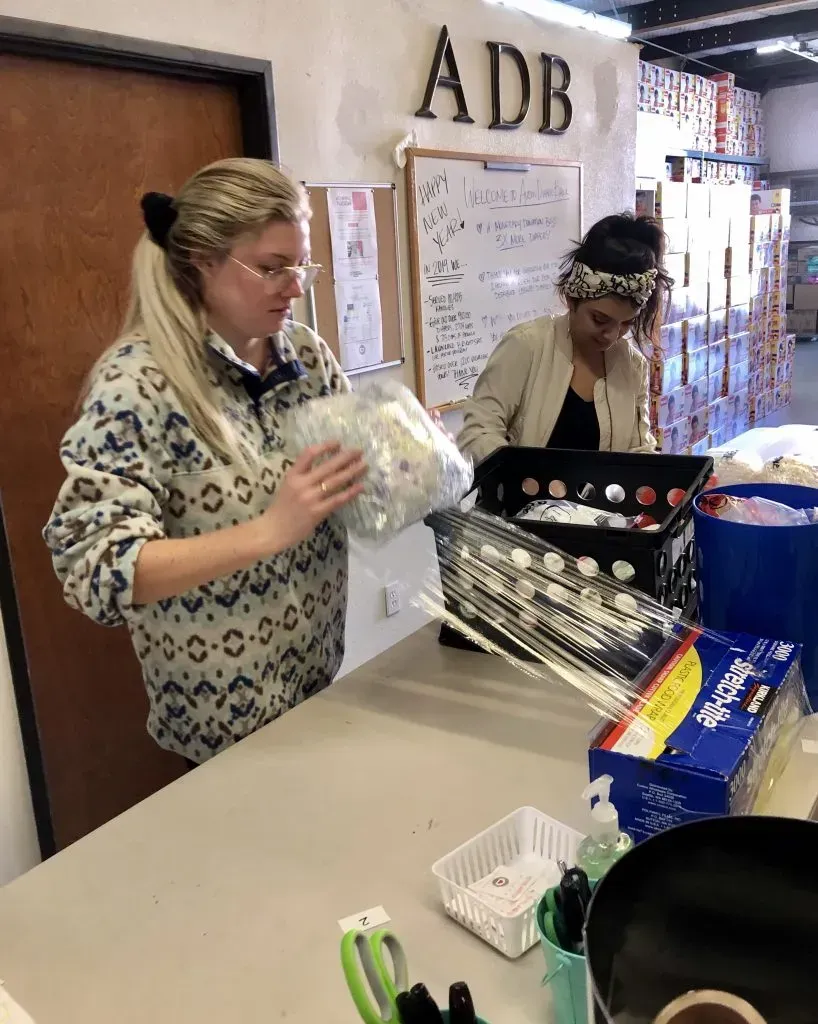 Sorting and wrapping diapers.