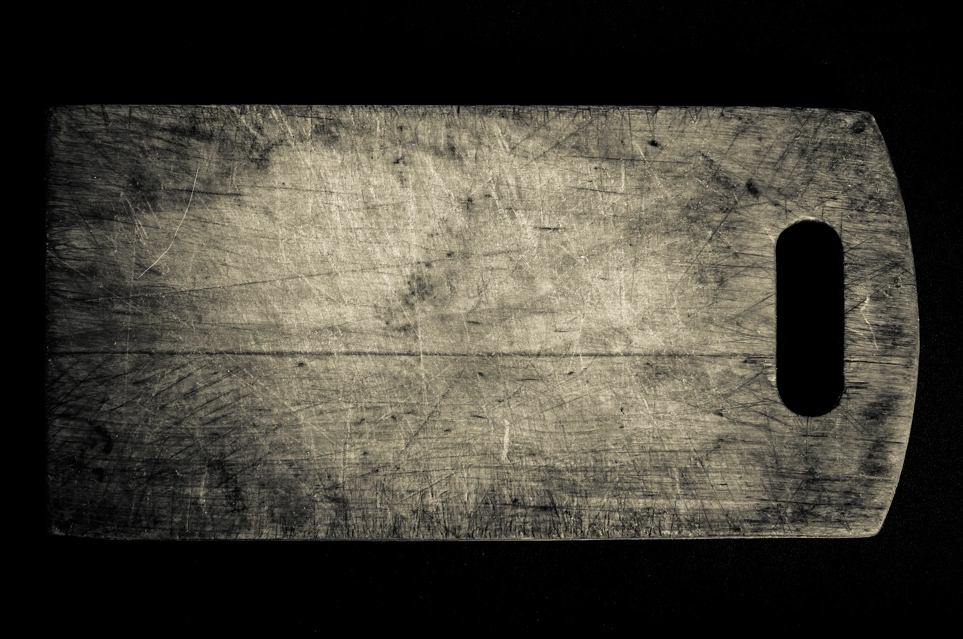 Close up detail shot of burned wood cutting board. 