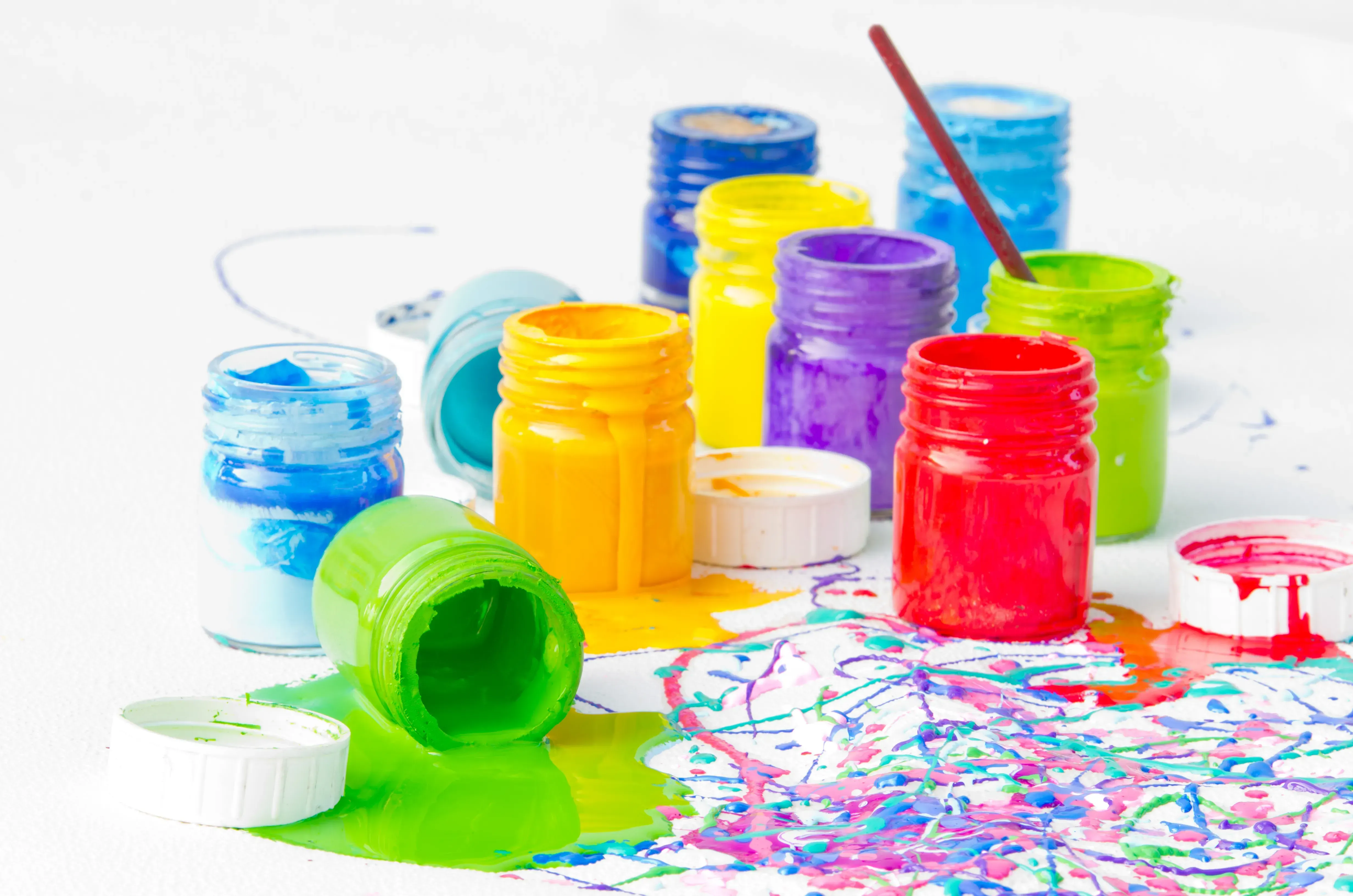 Colorful assortment of opened paint pots.