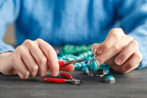Woman making handmade jewelry.