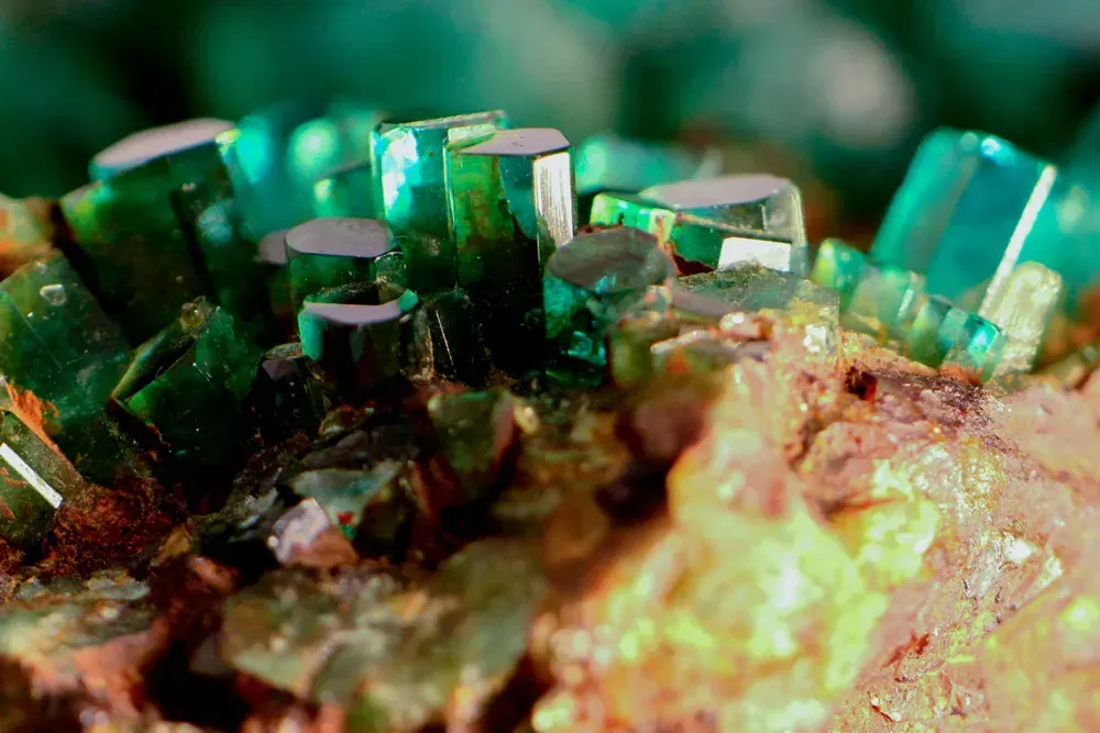 Emerald crystals in host rock.